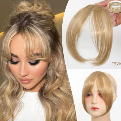 Frange rideau cheveux bouclés mi long coiffure chic