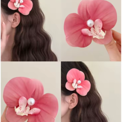 Pince hawaienne fleur orange feuille coiffure de fête