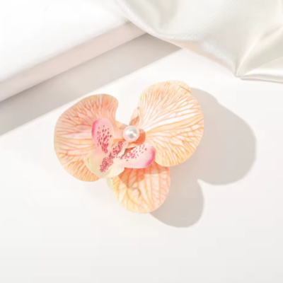 Pince hawaienne fleur orange feuille style exotique hawaïen